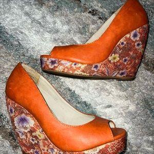 Orange Versona wedges with floral pattern